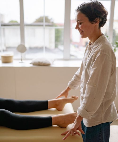Woman smiling peacefully after a gymnastics session.